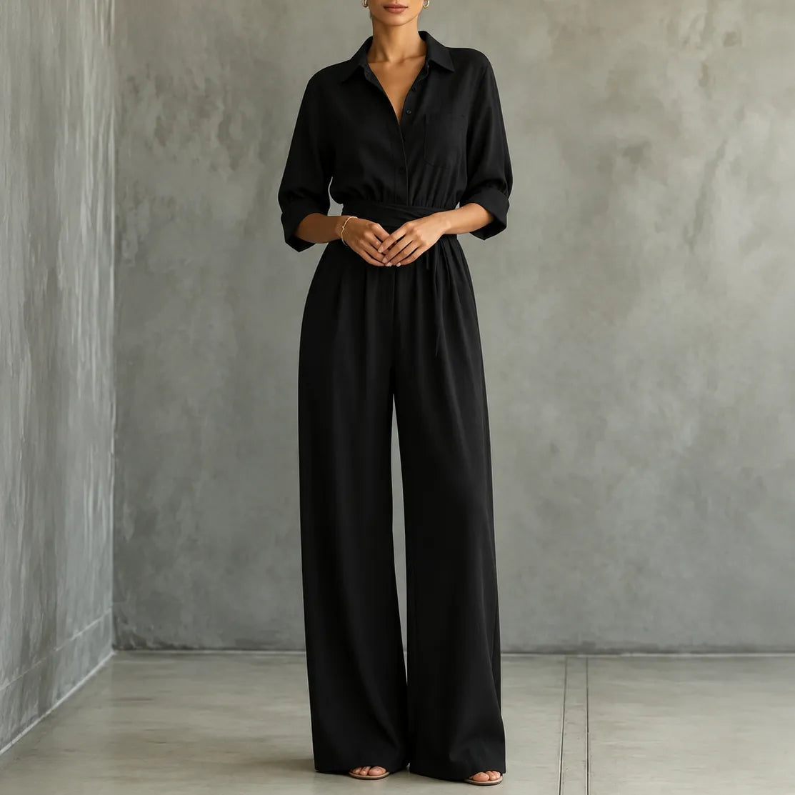 Black belted shirt jumpsuit with button front and wide-leg trousers
