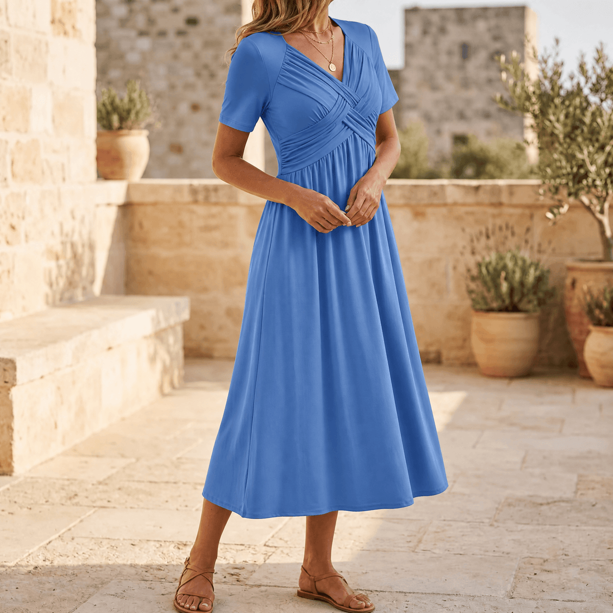 Powder blue crossover V-neck midi dress with empire waist, short sleeves, A-line skirt