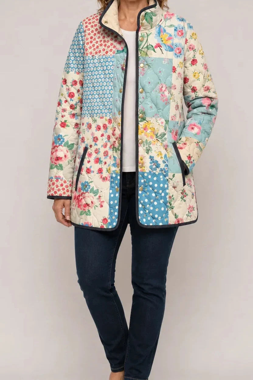 Wearbella patchwork quilted jacket with floral and geometric panels in blue, cream, and pink.